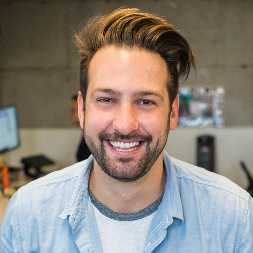 Happy man at home in light blue shirt