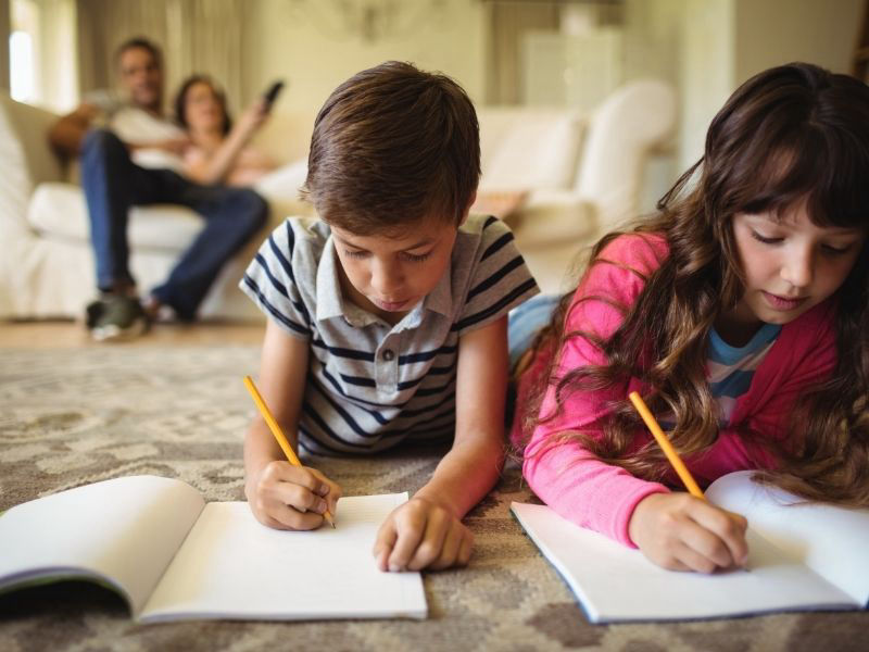 Kids doing homework on wool rug cleaned in Hamilton by Ecosuds