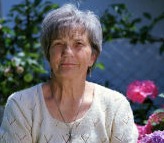 Senior woman outside happy after sofa cleaning